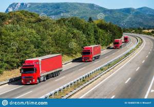 four-red-lorry-trucks-line-country-highway-caravan-convoy-under-beautiful-sky-164803156.jpg